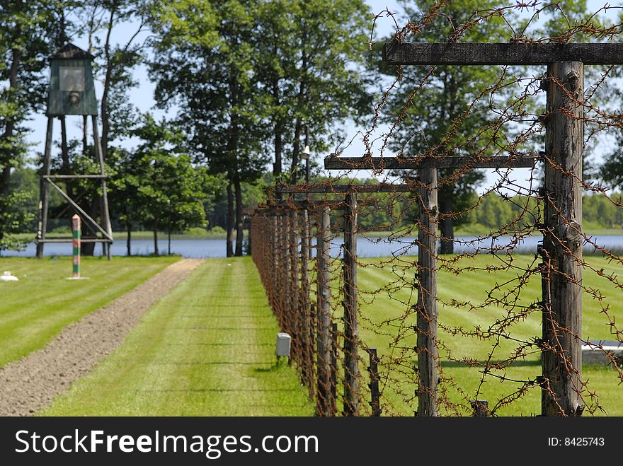 Lake and fence from a barbed wire