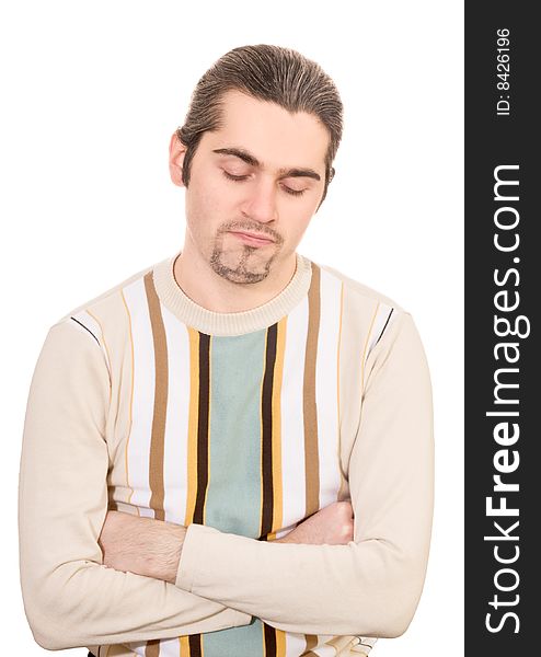 Young dark haired caucasian man in striped sweater looking down in dissappointment isolated on white. Young dark haired caucasian man in striped sweater looking down in dissappointment isolated on white