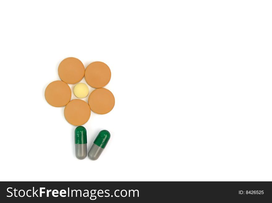 Symbolic flower made from tablets and capsules that helps to make positive impression from taking medicines. Symbolic flower made from tablets and capsules that helps to make positive impression from taking medicines