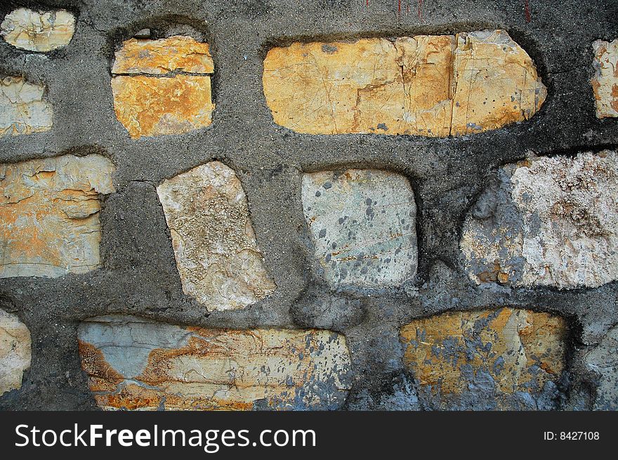 The old stone masonry wall. The old stone masonry wall