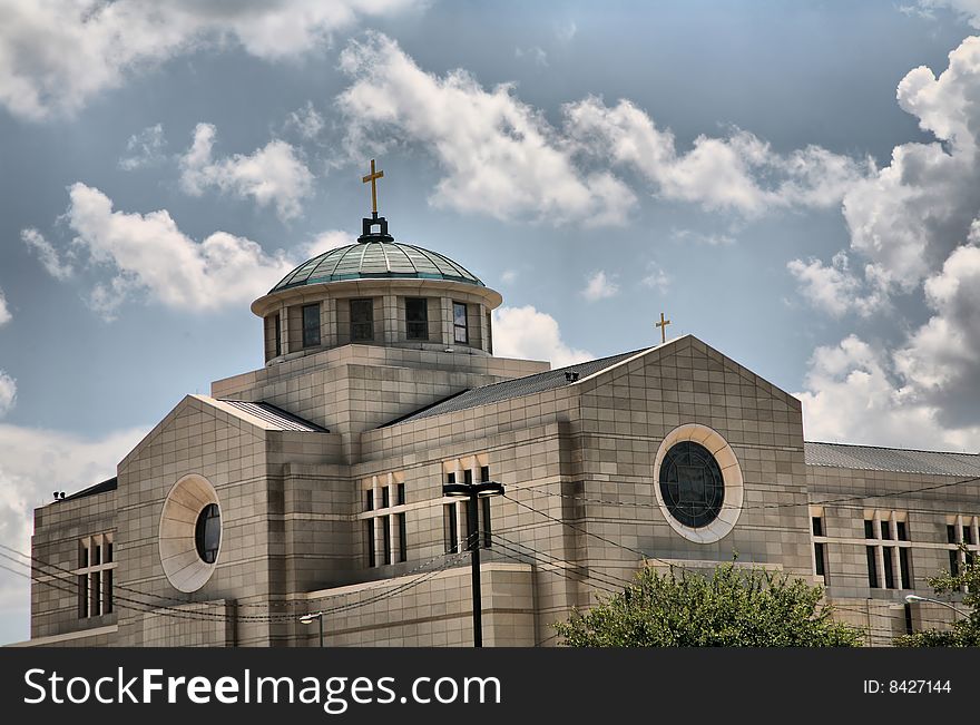 Church against cloudy blue sky