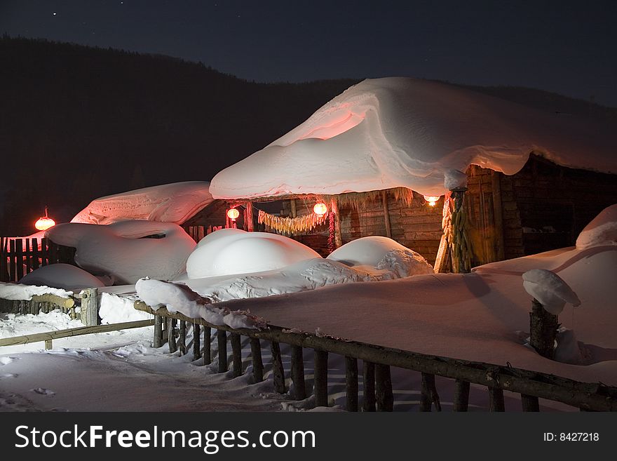 A house covered in snow  in winter