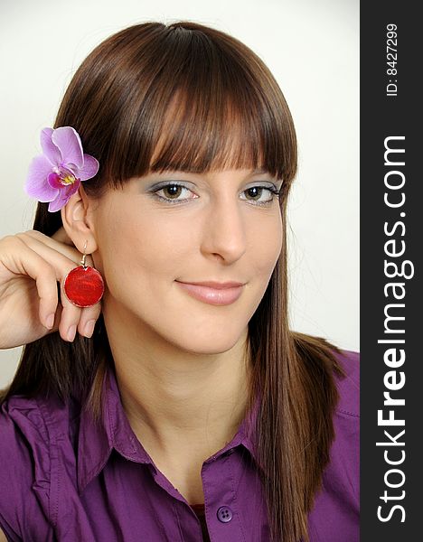 Portrait of a beautiful young girl with flower behind her ear. Portrait of a beautiful young girl with flower behind her ear