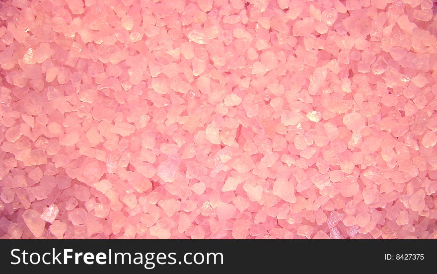 Pink granules of salt for acceptance of bath