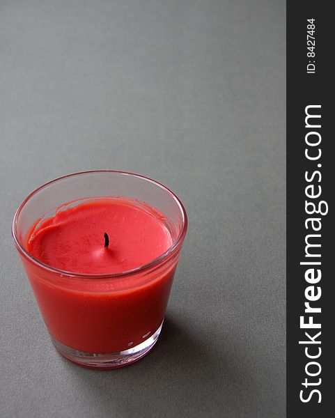 Red Candle against the Green Background