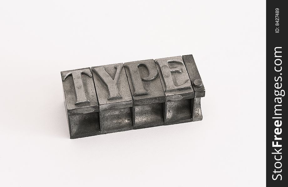 Isolated shot of metal typographic letters forming the word type.