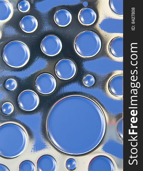 Background of blue textured metal with circles