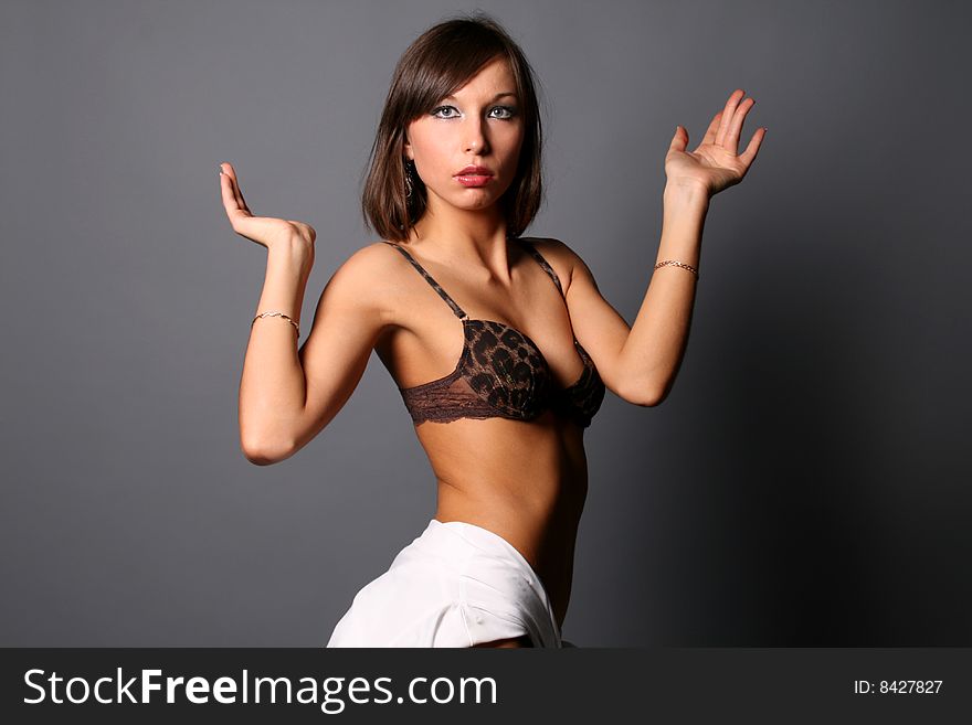 Seductive girl in underwear standing in studio