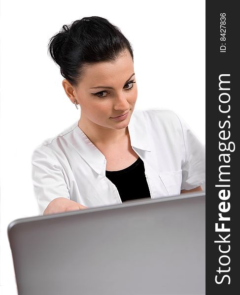 Young doctor is looking the laptop, isolated in white background. Young doctor is looking the laptop, isolated in white background