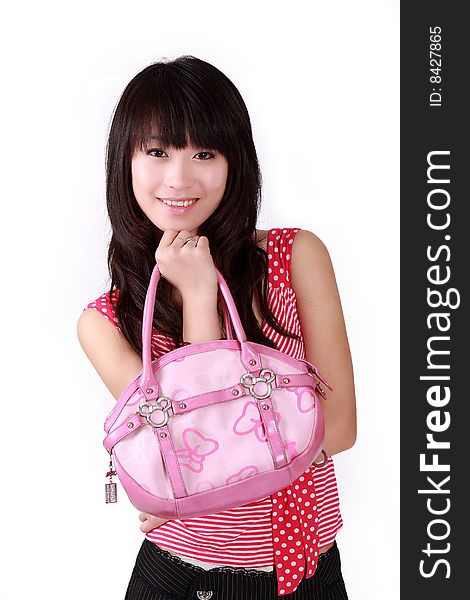 A beautiful Asian girl with pink handbag on white background.