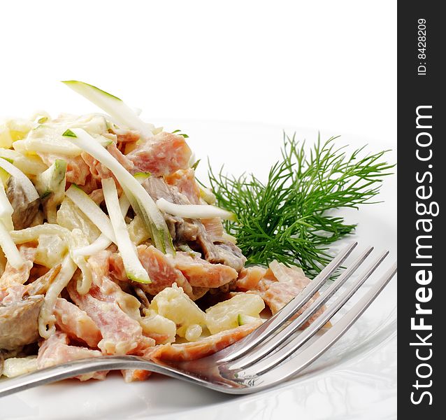 Salad Comprises Chopped Ham, Cucumber and Cheese Dressed Dill. Isolated on White Background