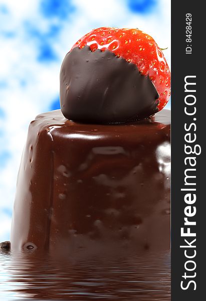 Chocolate Cake with Fresh Strawberry on Blue Sky Background