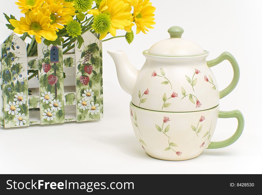 Teapot And Cup With Yellow Flowers