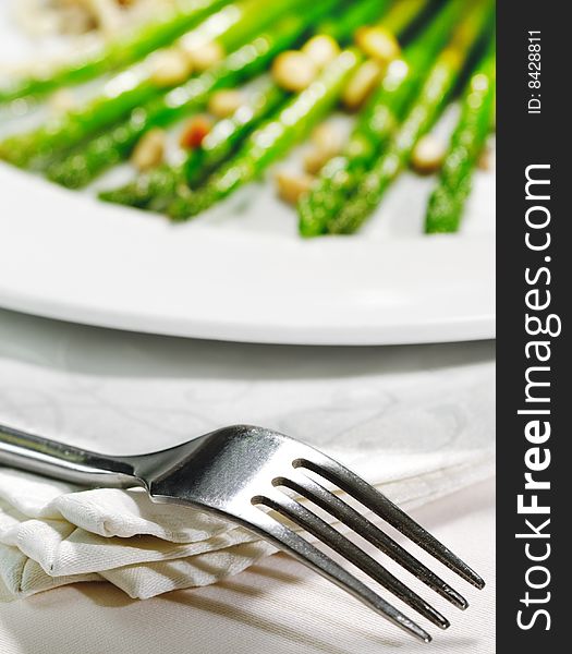Fork and Fresh Asparagus on a Background. Selective Focus