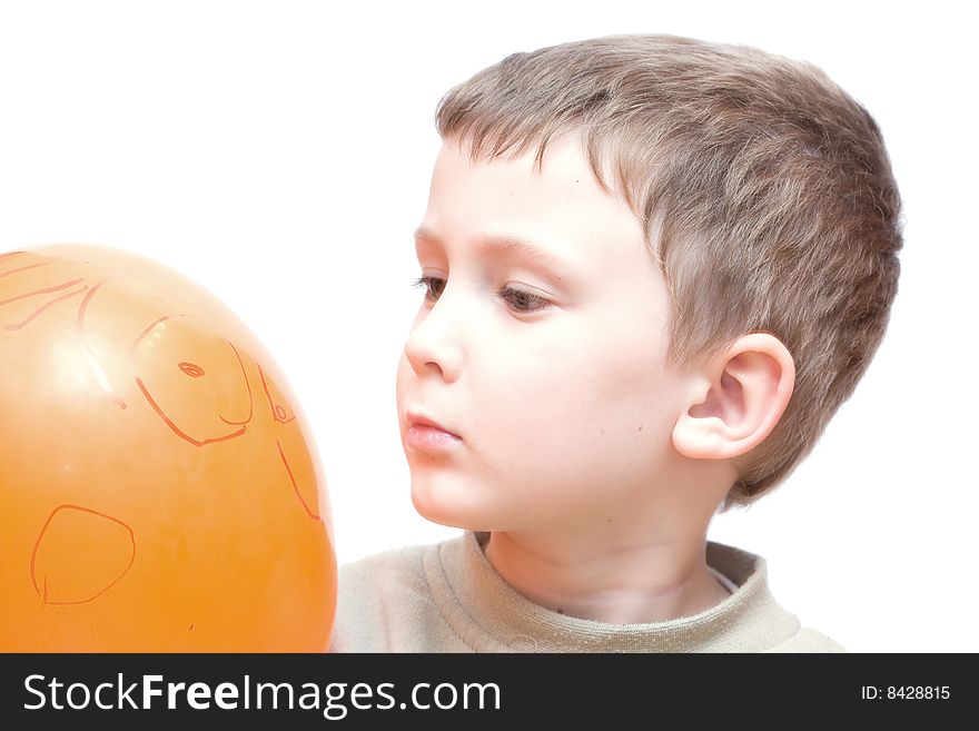 Little boy looking on balloon. Little boy looking on balloon