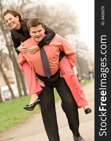 Playful active caucasian couple at outdoors background