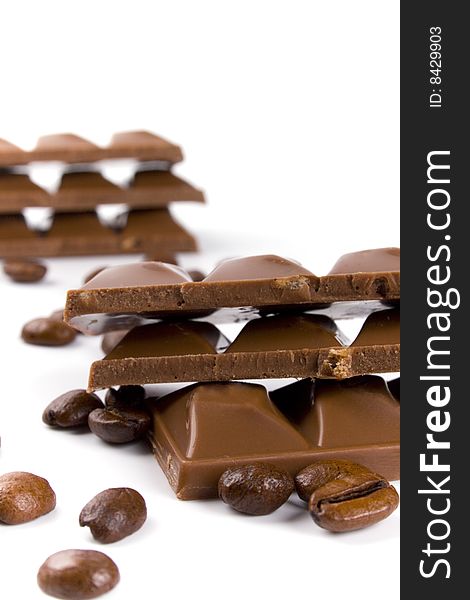 Chocolate and coffee beans on white background