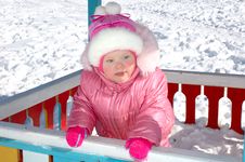 Pretty Little Girl And Winter Playground. Royalty Free Stock Image