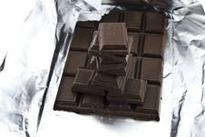 Broken Chocolate On A Foil Royalty Free Stock Image Broken Chocolate On A Foil Royalty Free Stock Image