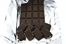 Broken Chocolate On A Foil Royalty Free Stock Photography