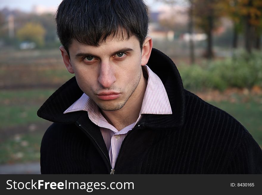 Portrait  beauty  young guy  on the garden. Portrait  beauty  young guy  on the garden