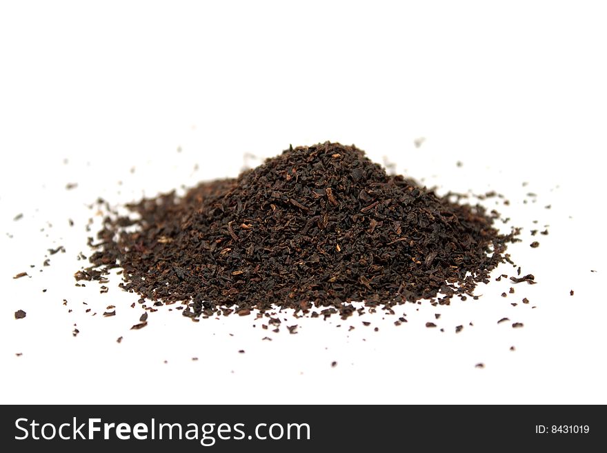 Pinch of black tea isolated on the white background
