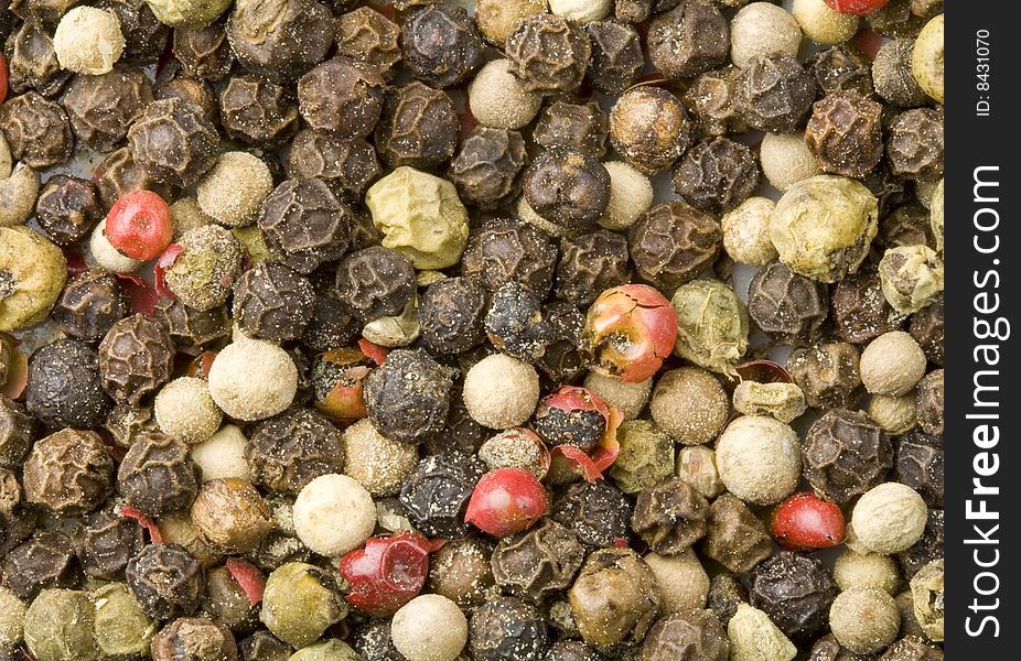 A close-up of a lot of different colour pepper. A close-up of a lot of different colour pepper