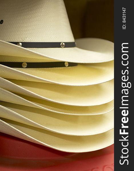 Stack of six new cowboy hats in store. Stack of six new cowboy hats in store.