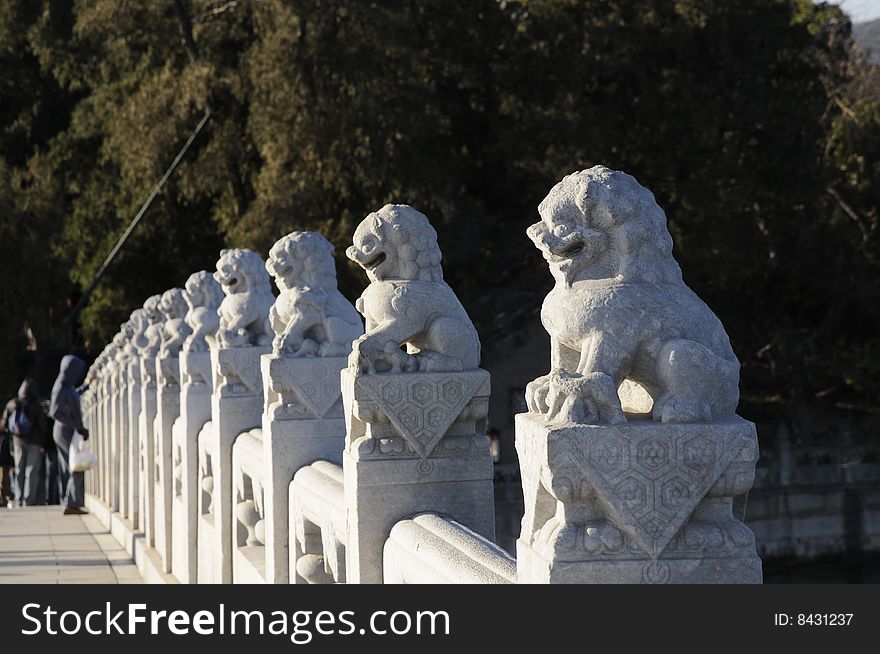 Stone lion statue in line, ancient chinese park