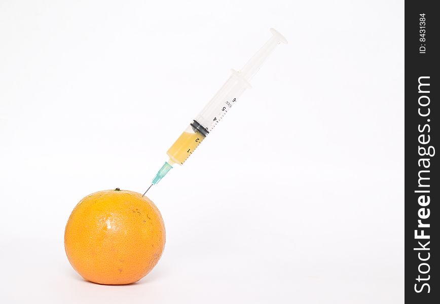 Orange with syringe
isolated on a white background