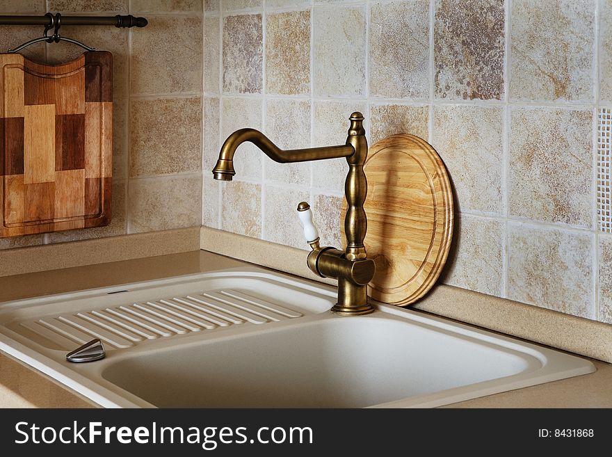 The beautiful water faucet of bronze color