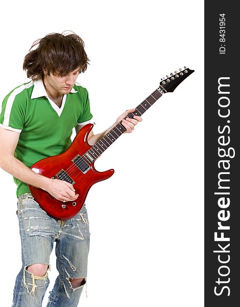 Headbanging guitarist playing his electric guitar. Headbanging guitarist playing his electric guitar
