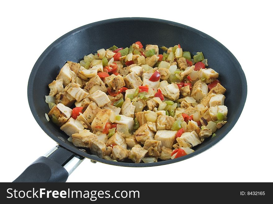 Pan full of chicken, peppers and onions isolated on white. Pan full of chicken, peppers and onions isolated on white