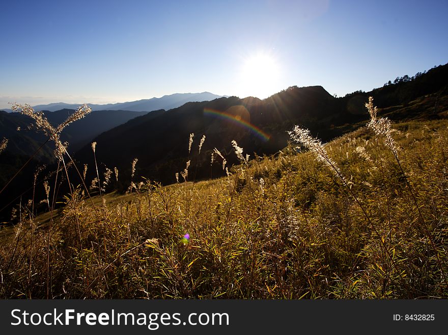 Sees the beautiful sunrise on the mountain. Sees the beautiful sunrise on the mountain