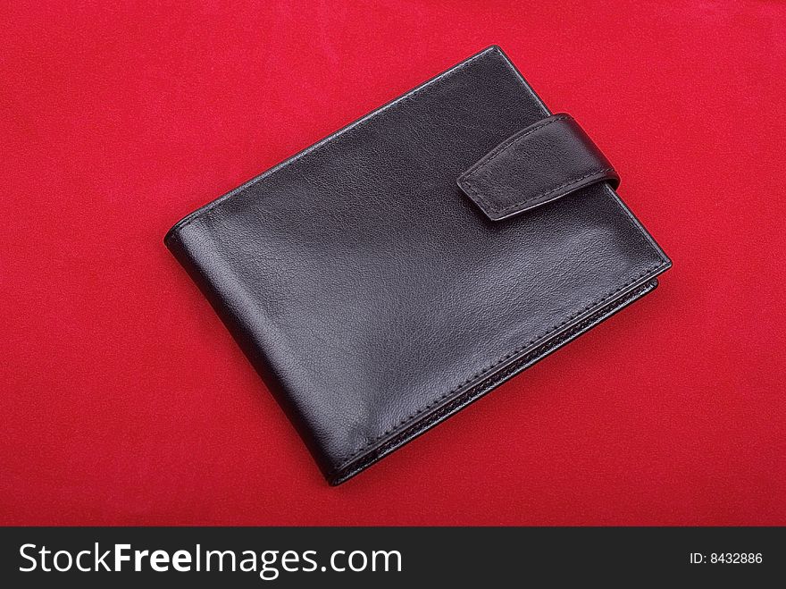 Wallet on red velvet.