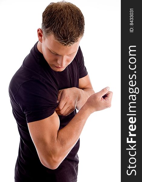 Muscular man showing his muscles on an isolated background