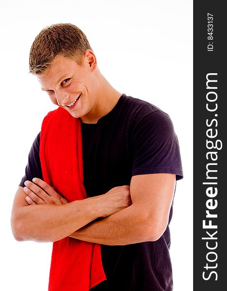 Smiling handsome male with crossed arms against white background