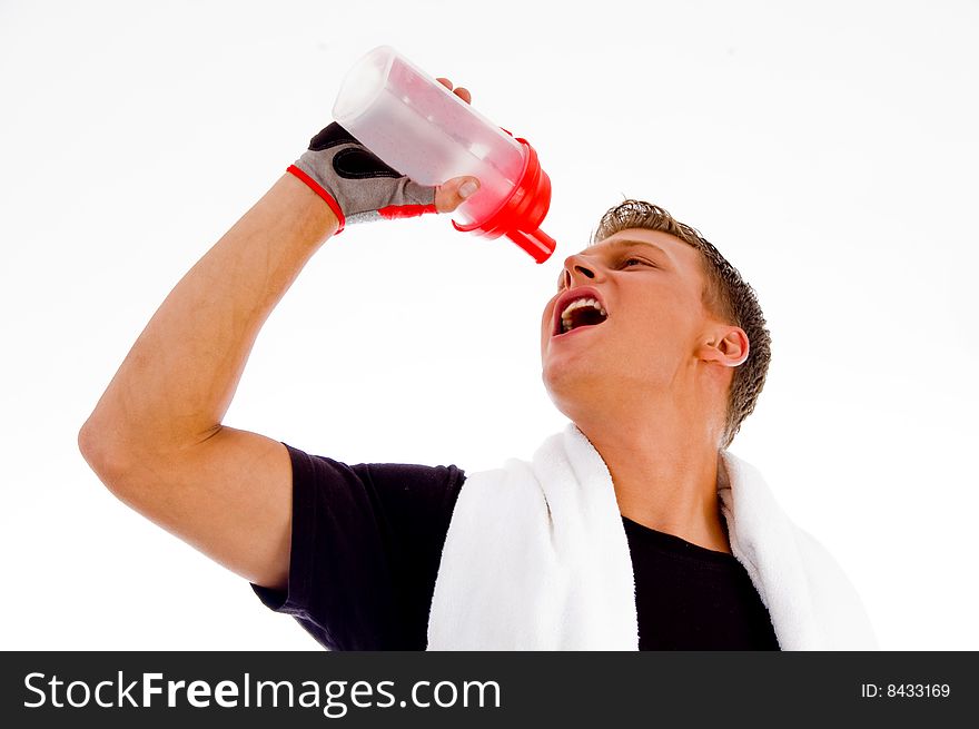 Muscular man posing with water bottle on an isolated white background