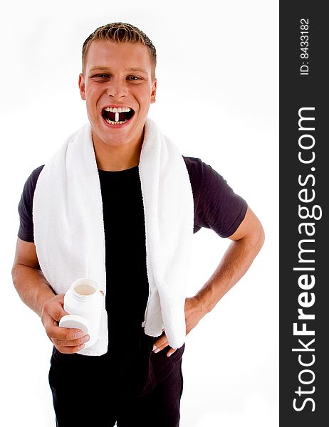 Man going to swallow medicine against white background