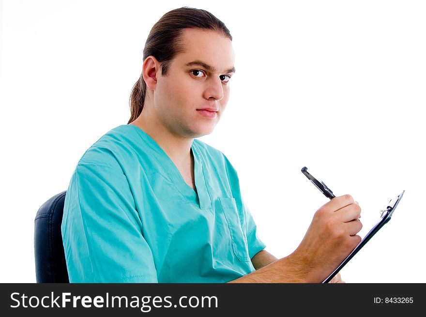 Male surgeon writing prescription on an isolated white background