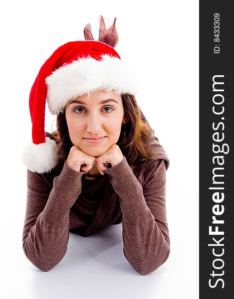 Female in christmas hat lying on floor on an isolated white background