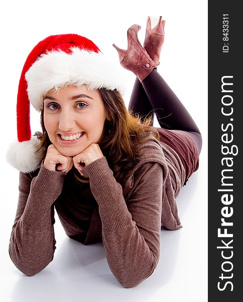 Young woman in christmas hat smiling at camera on an isolated white background