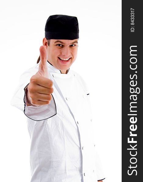 Cheerful male chef with thumbs up on an isolated white background