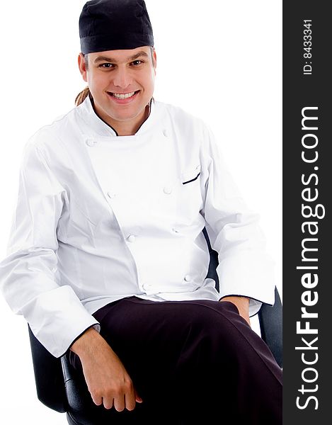 Smiling young male chef on an isolated white background