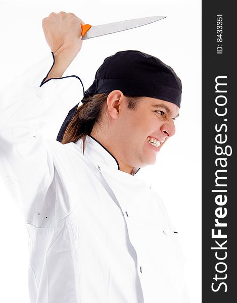 Dangerous young male chef with knife on an isolated white background