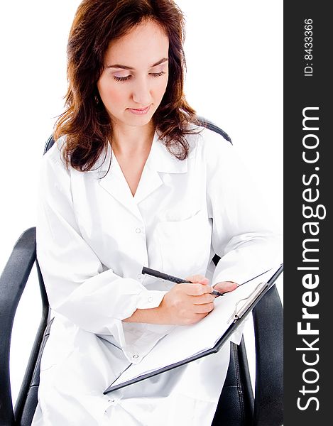 Female surgeon writing prescription on an isolated white background