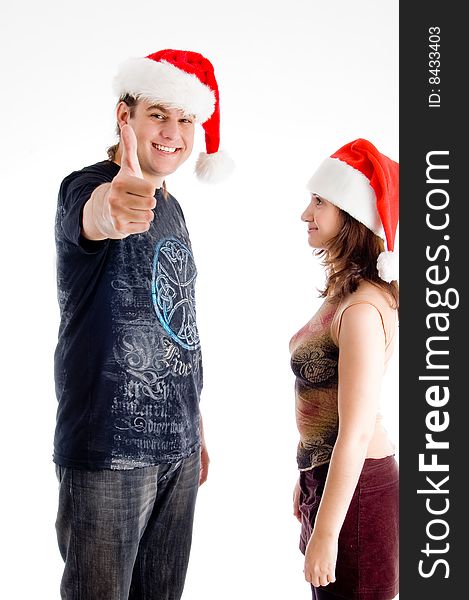 Standing couple with christmas hat on an isolated white background
