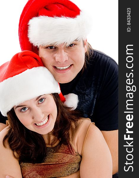 Close view of young couple with christmas hat on an isolated white background