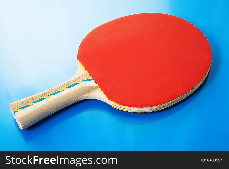Tennis Racket And Orange Ball