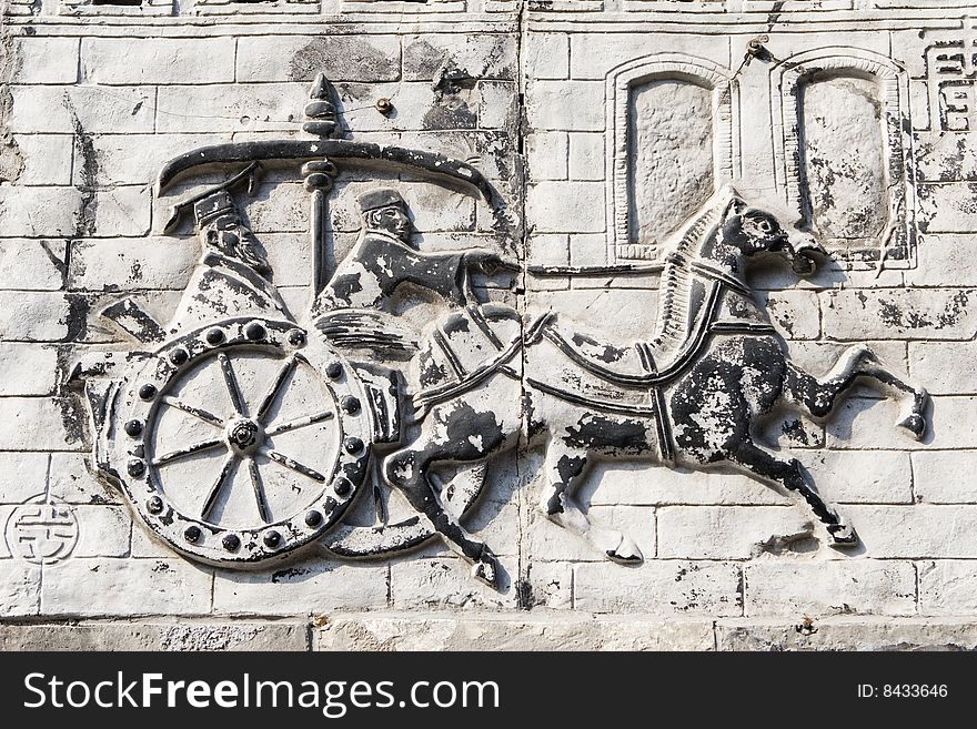 Chinese traditional brick carving on a building wall, beijing, china.